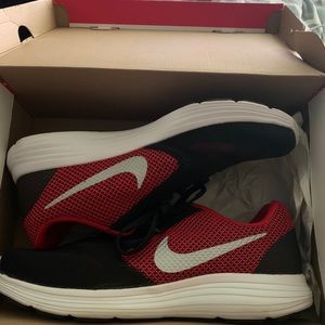 Red black and white Nike shoes